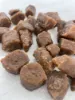 Close-up of organic asafoetida (hing) cubes showing texture.
